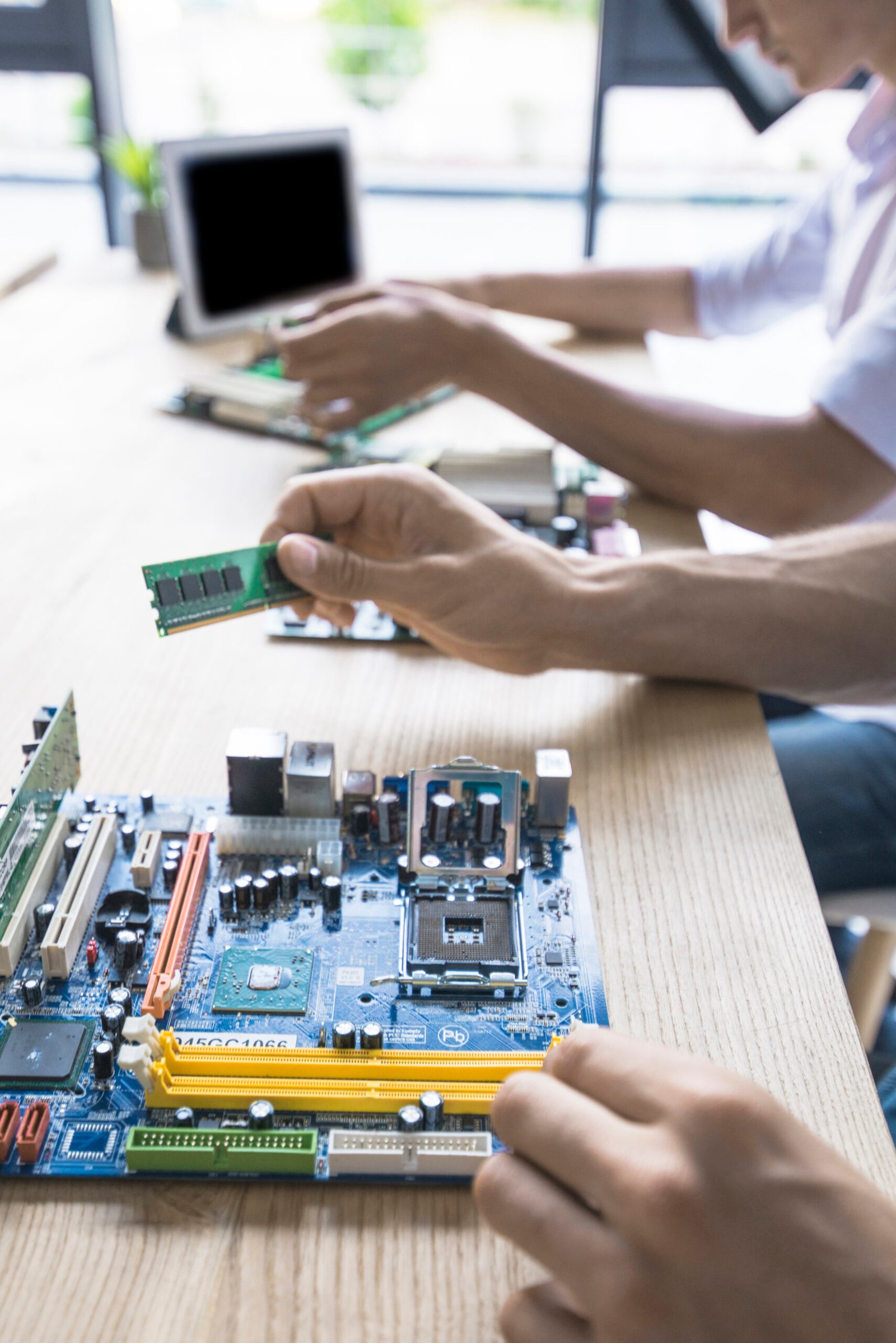 technician-repairing-computer-motherboard